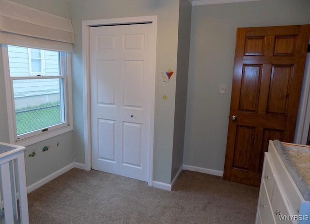 225 Fries Rd, Tonawanda-Town, NY 14150 - unfurnished bedroom featuring light colored carpet, baseboards, and a closet