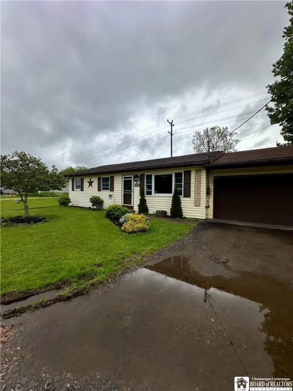 538 Erie St, Olean-City, NY 14760 - ranch-style house with driveway, an attached garage, and a front yard