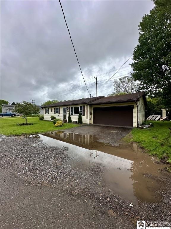 538 Erie St, Olean-City, NY 14760 - single story home with a garage, a front lawn, and asphalt driveway