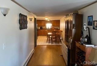 7090 Lakeshore Rd, Cicero, NY 13039 - hallway featuring wood finished floors and a baseboard radiator