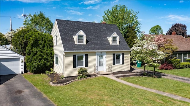 22 Idyllwood Ln, Irondequoit, NY 14617 - cape cod-style house featuring an outbuilding, a front lawn, and a shingled roof
