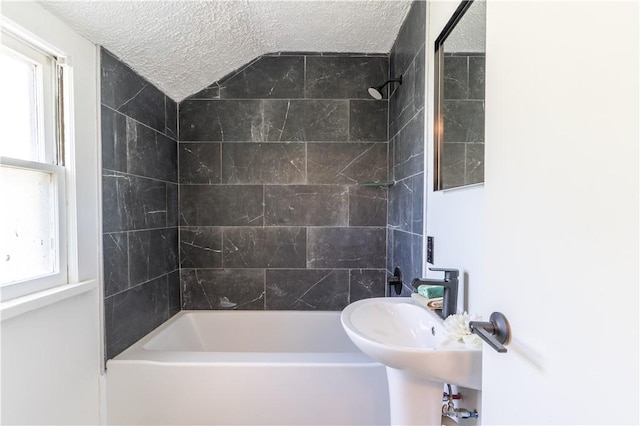 22 Idyllwood Ln, Irondequoit, NY 14617 - full bath with a textured ceiling, shower / bath combination, a sink, and lofted ceiling