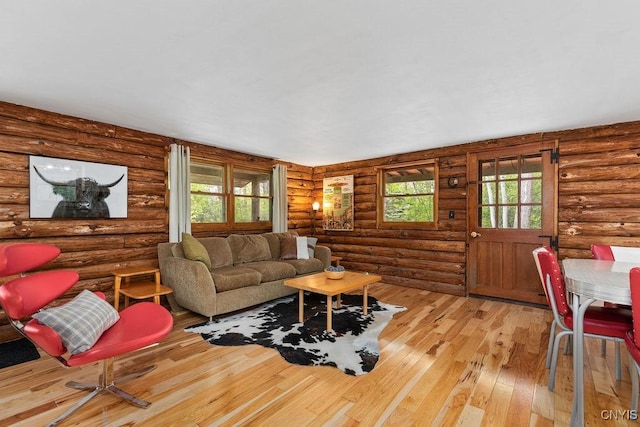 4090 Old Kennedy Rd, Onondaga, NY 13120 - living area with light wood-style flooring and log walls