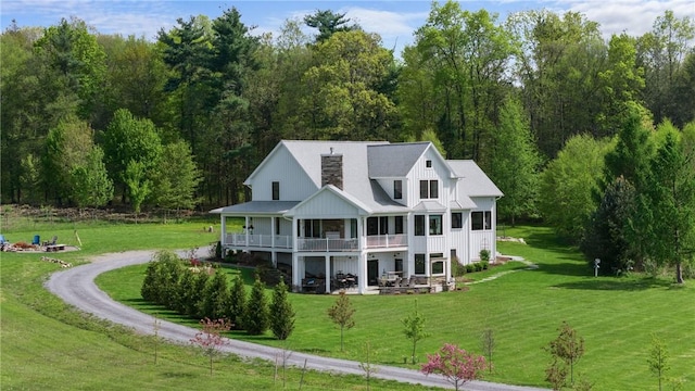 503 Grandview Ln, Milo, NY 14527 - rear view of property with a yard, a forest view, and a balcony
