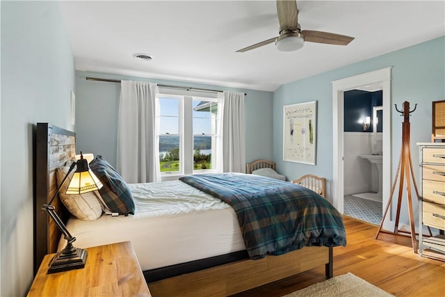 503 Grandview Ln, Milo, NY 14527 - bedroom featuring wood finished floors, ensuite bath, and a ceiling fan