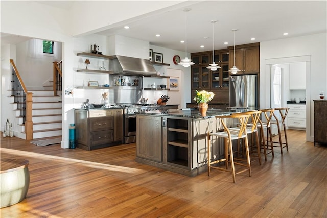 503 Grandview Ln, Milo, NY 14527 - bar featuring exhaust hood, stainless steel appliances, light wood finished floors, stairway, and recessed lighting