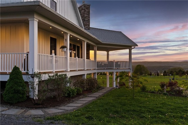 503 Grandview Ln, Milo, NY 14527 - property exterior at dusk featuring a chimney and a lawn