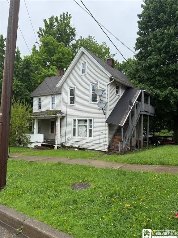 626 Spring St, Jamestown, NY 14701 - rear view of property with a chimney, a yard, stairs, and a deck