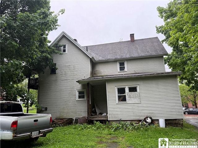 626 Spring St, Jamestown, NY 14701 - rear view of house featuring a chimney and a shingled roof