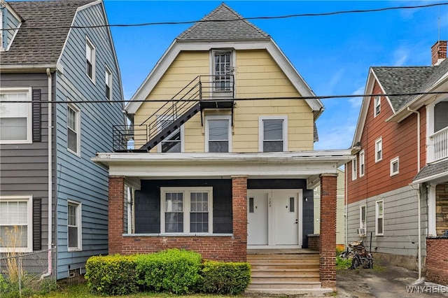 123 6th St, Niagara Falls, NY 14303 - view of front of house featuring covered porch, brick siding, and roof with shingles