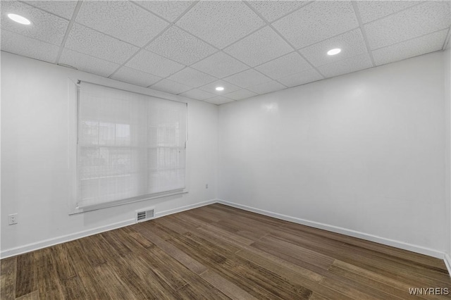123 6th St, Niagara Falls, NY 14303 - spare room with dark wood-style flooring, a drop ceiling, recessed lighting, and baseboards