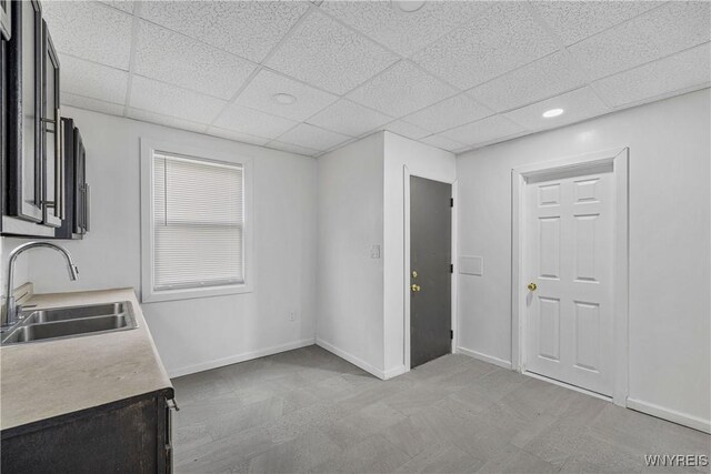 123 6th St, Niagara Falls, NY 14303 - kitchen with a sink, a paneled ceiling, light countertops, baseboards, and recessed lighting