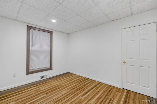 123 6th St, Niagara Falls, NY 14303 - empty room with a paneled ceiling, wood finished floors, recessed lighting, and baseboards