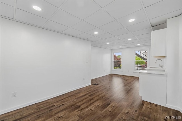123 6th St, Niagara Falls, NY 14303 - unfurnished living room featuring dark wood-type flooring, a sink, recessed lighting, and baseboards