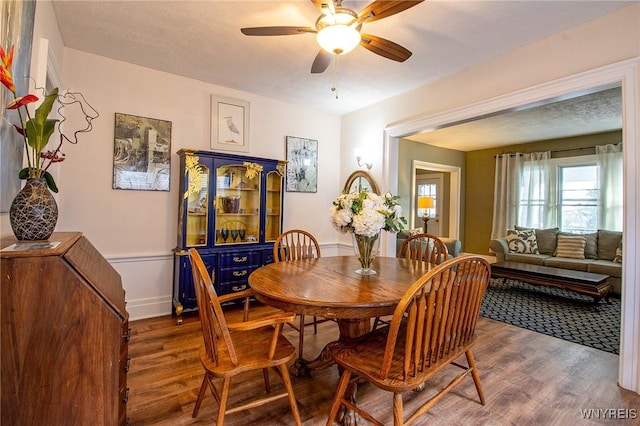 624 Buffalo Ave, Niagara Falls, NY 14303 - dining area with wood finished floors, ceiling fan, and baseboards
