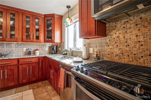 624 Buffalo Ave, Niagara Falls, NY 14303 - kitchen featuring stainless steel appliances, a sink, light stone countertops, and decorative backsplash