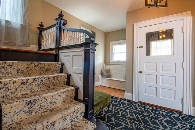 624 Buffalo Ave, Niagara Falls, NY 14303 - entryway with baseboards, stairs, and carpet