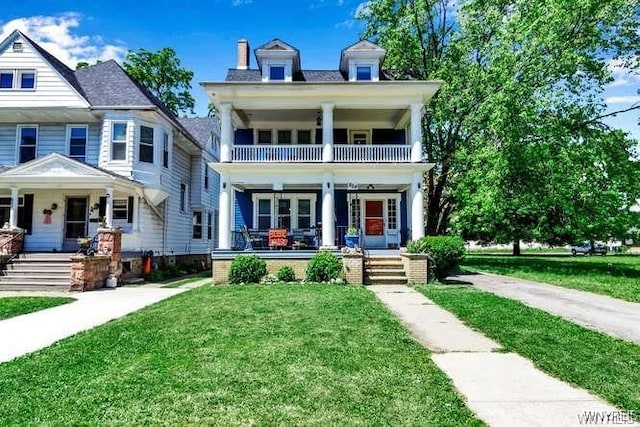 624 Buffalo Ave, Niagara Falls, NY 14303 - neoclassical home featuring a porch, a balcony, and a front yard