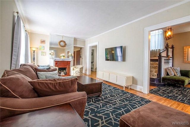 624 Buffalo Ave, Niagara Falls, NY 14303 - living area featuring light wood-style floors, ornamental molding, baseboards, and a chandelier