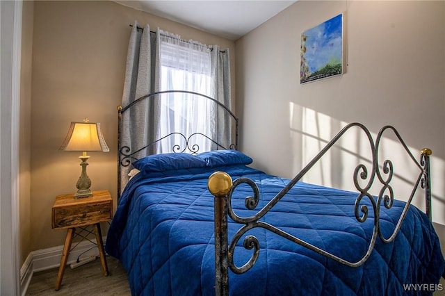 624 Buffalo Ave, Niagara Falls, NY 14303 - bedroom with wood finished floors and baseboards
