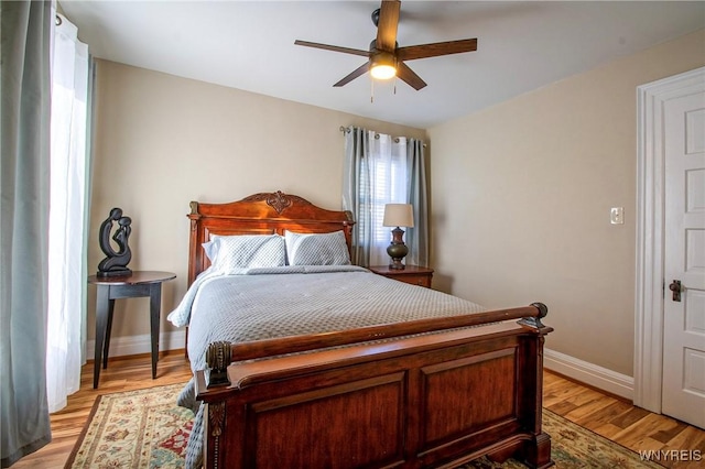 624 Buffalo Ave, Niagara Falls, NY 14303 - bedroom with baseboards, light wood-type flooring, and a ceiling fan