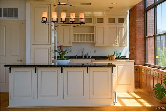 526 Plum St Unit 408, Syracuse, NY 13204 - bar with a sink and hanging light fixtures