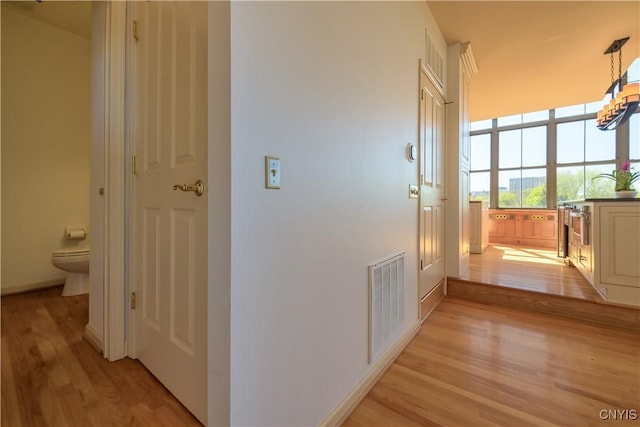 526 Plum St Unit 408, Syracuse, NY 13204 - corridor with light wood-type flooring and baseboards
