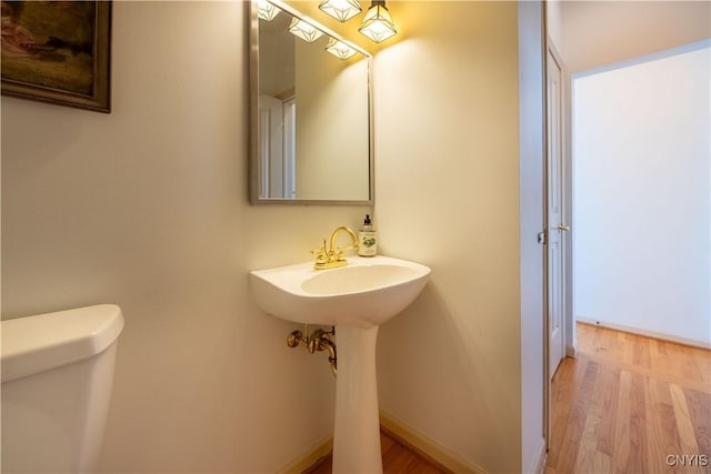 526 Plum St Unit 408, Syracuse, NY 13204 - half bath with toilet and wood finished floors