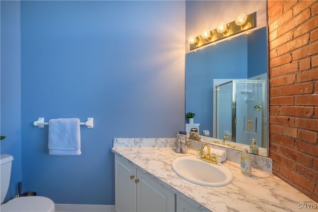 526 Plum St Unit 408, Syracuse, NY 13204 - bathroom with vanity, a shower stall, toilet, and brick wall