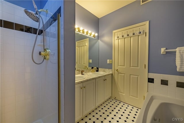 526 Plum St Unit 408, Syracuse, NY 13204 - full bath with tiled shower, double vanity, and a garden tub