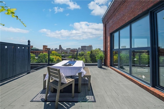 526 Plum St Unit 408, Syracuse, NY 13204 - wooden deck featuring outdoor dining area
