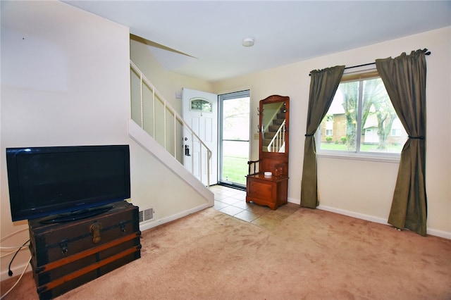 414 Fox Run, Gates, NY 14606 - living room with stairway, carpet flooring, and baseboards