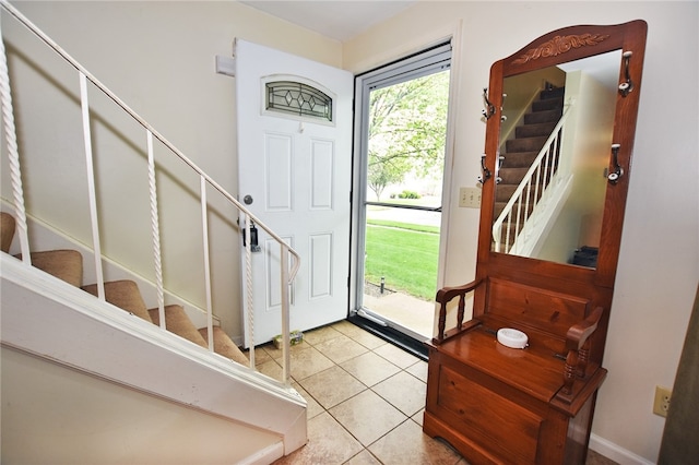 414 Fox Run, Gates, NY 14606 - foyer with stairs and light tile patterned floors
