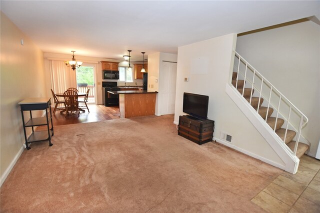 414 Fox Run, Gates, NY 14606 - living room featuring a chandelier, light colored carpet, baseboards, and stairs