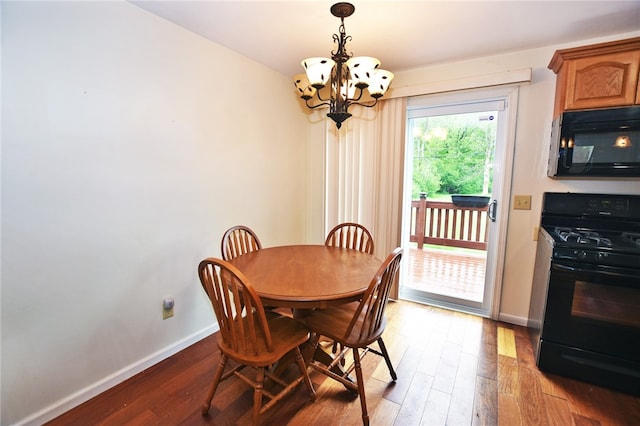 414 Fox Run, Gates, NY 14606 - dining space with a chandelier, baseboards, and light wood finished floors