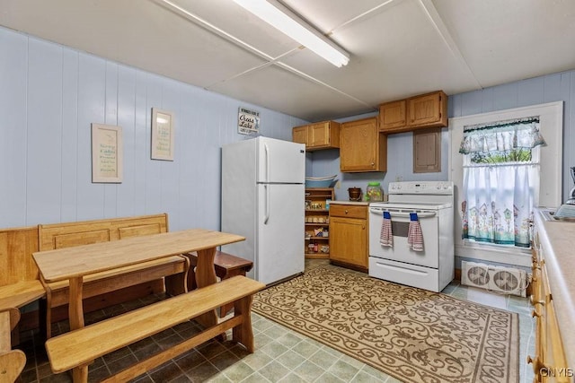 633 Eno Rd, Elbridge, NY 13080 - kitchen with white appliances, light countertops, brown cabinets, and light flooring