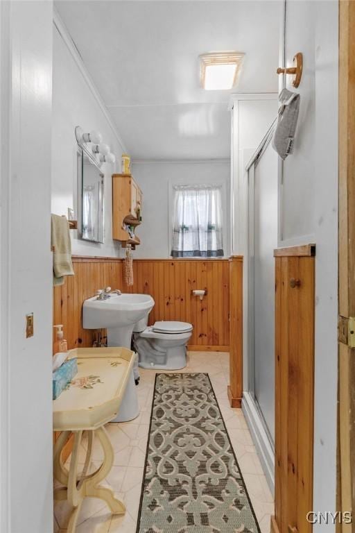 633 Eno Rd, Elbridge, NY 13080 - full bath featuring a wainscoted wall, a shower stall, toilet, wooden walls, and a sink