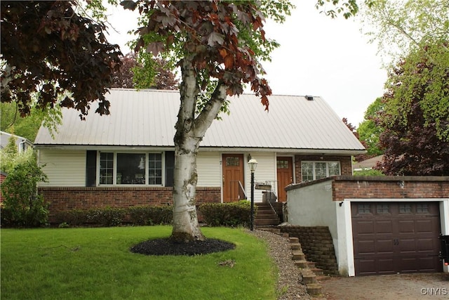 7 Catlin Ave, Paris, NY 13456 - view of front of home with brick siding, a garage, a front yard, and metal roof