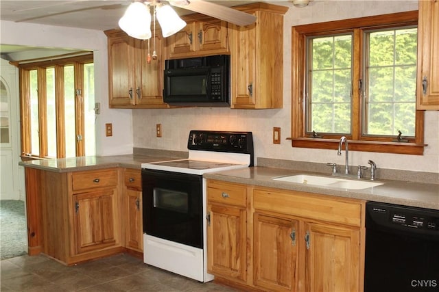 7 Catlin Ave, Paris, NY 13456 - kitchen featuring black appliances, a sink, ceiling fan, a peninsula, and light countertops