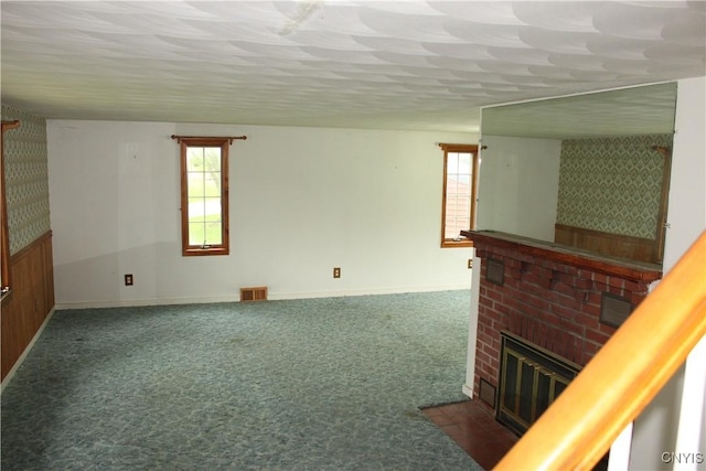 7 Catlin Ave, Paris, NY 13456 - unfurnished living room with a fireplace, carpet floors, baseboards, and wallpapered walls