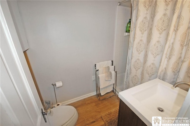 178 W Main St, Westfield, NY 14787 - full bathroom with radiator heating unit, a shower with curtain, toilet, vanity, and wood finished floors