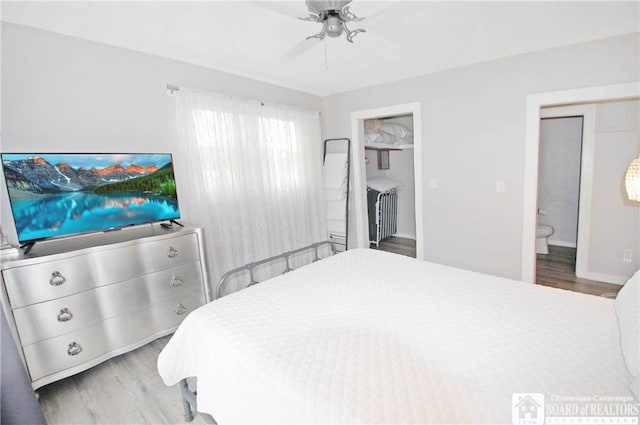 178 W Main St, Westfield, NY 14787 - bedroom featuring wood finished floors, ensuite bath, a ceiling fan, and baseboards