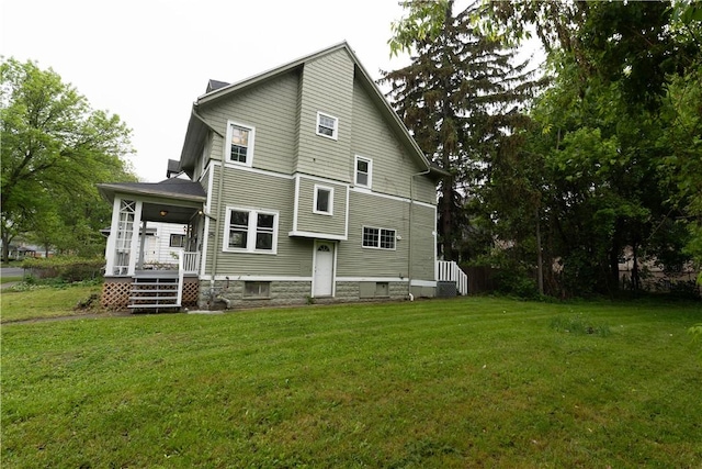 135 Gardiner Ave, Rochester, NY 14611 - rear view of property with a yard