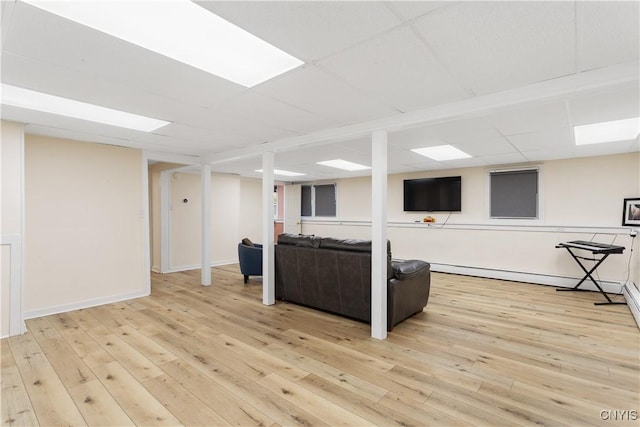27 Cascade Dr, New Hartford, NY 13413 - living room with light wood-style floors, a baseboard radiator, and a paneled ceiling