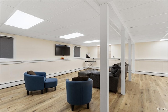 27 Cascade Dr, New Hartford, NY 13413 - living area featuring a baseboard radiator, hardwood / wood-style flooring, and a paneled ceiling