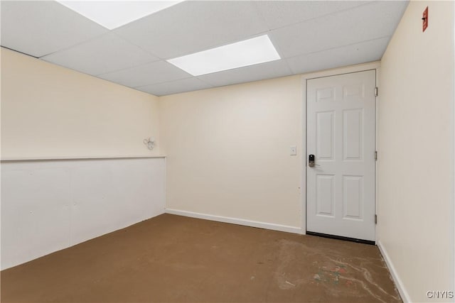 27 Cascade Dr, New Hartford, NY 13413 - unfurnished room featuring a paneled ceiling, concrete floors, and baseboards