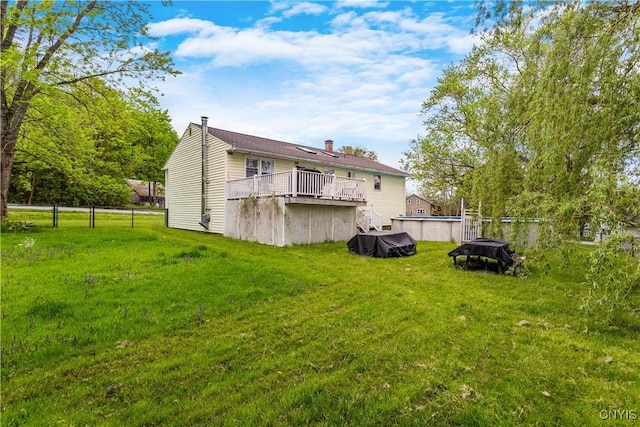 27 Cascade Dr, New Hartford, NY 13413 - back of house with a swimming pool, a yard, and a deck