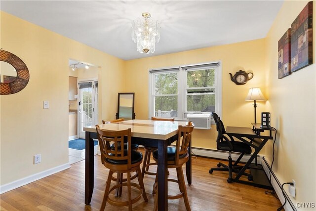 27 Cascade Dr, New Hartford, NY 13413 - dining space with plenty of natural light, light wood-style flooring, a chandelier, and baseboards