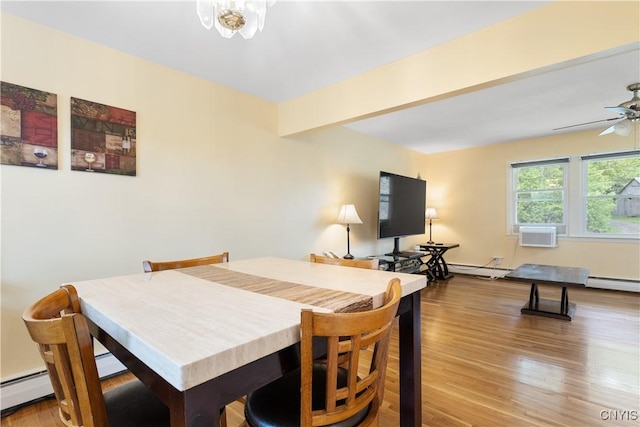 27 Cascade Dr, New Hartford, NY 13413 - dining room featuring a baseboard radiator, wood finished floors, and ceiling fan