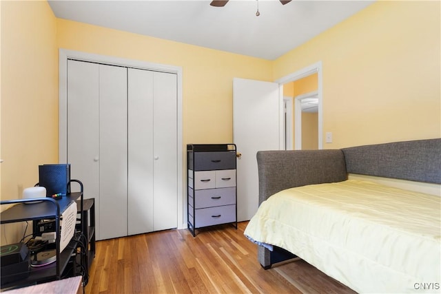 27 Cascade Dr, New Hartford, NY 13413 - bedroom featuring wood finished floors, a closet, a ceiling fan, and a desk